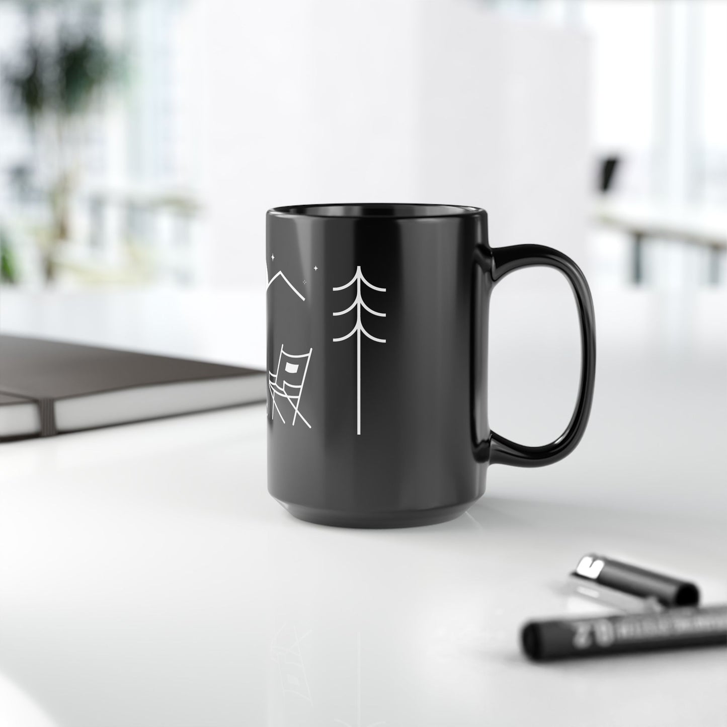 Side view of a ceramic mug with the MyPeople Campfire line illustration, handle on the right.
