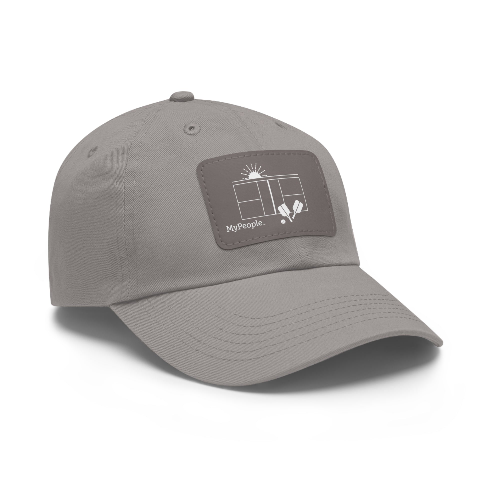 Angled view of a hat with a leather patch printed with the MyPeople Pickleball line illustration.
