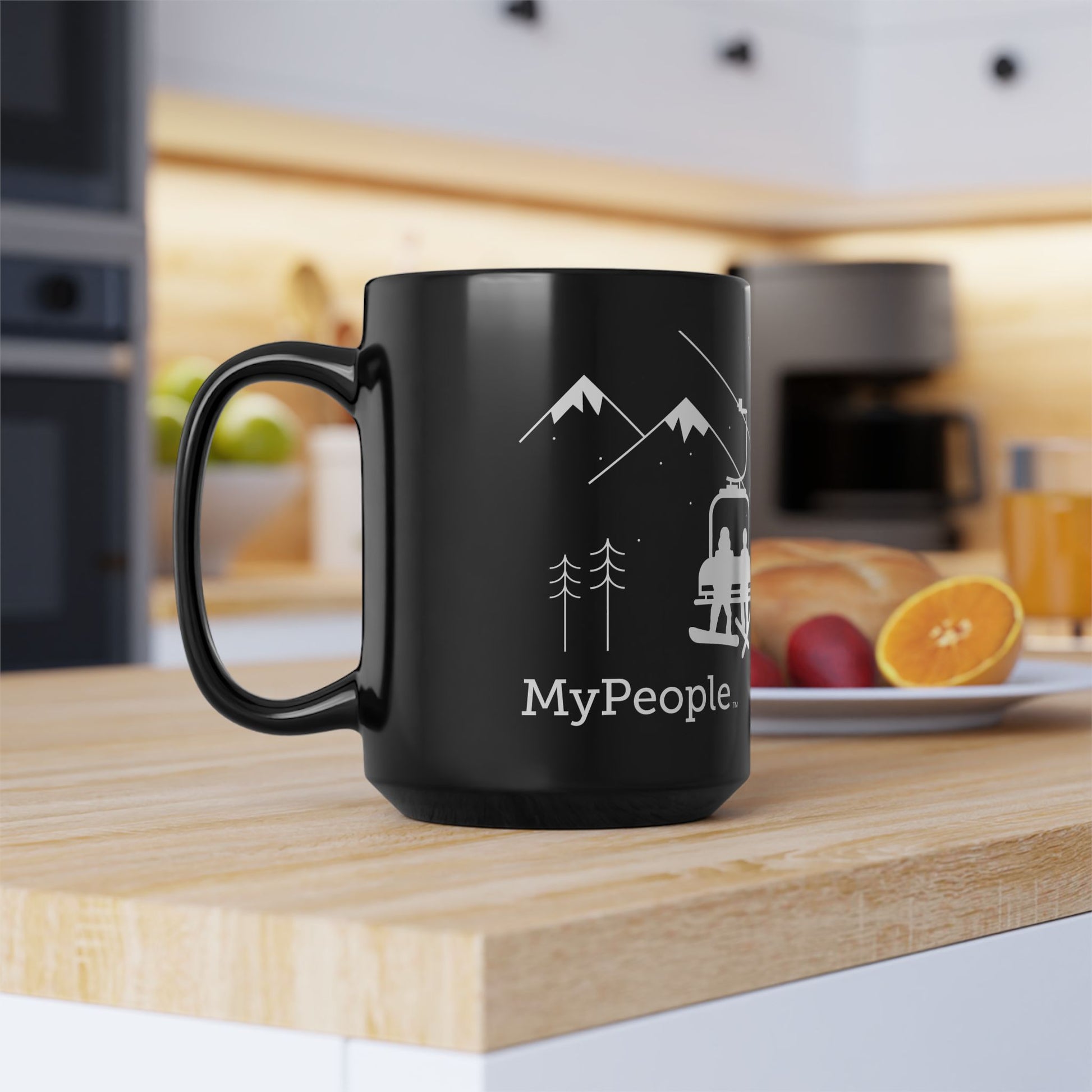 Side view of a ceramic mug with the MyPeople Snowsports line illustration, handle on the left.
