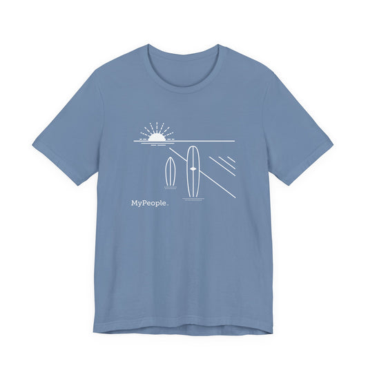 line illustration of two surfboards standing upright in the sand with a setting sun behind, with the word MyPeople underneath on a unisex t-shirt.